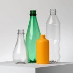 Carbios has released several prototypes of enzimatically recycled plastic bottles. Biotherm could be the first L'Oréal brand to launch a product that comes in a plastic cosmetic bottle that is entirely recycled thanks to Carbios's enzymatic technology. (Photo : © Courtesy of Carbios)